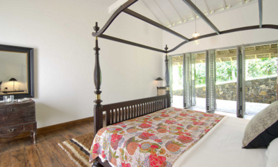 Ivory House Bedroom with Four Poster Bed and Wooden Floor | Galle, Sri Lanka