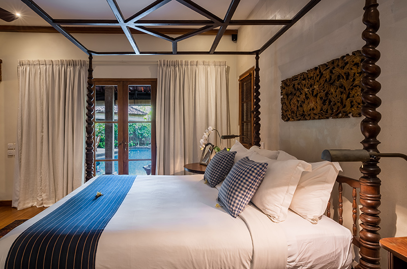 Villa Oost Indies Bedroom One with Four Poster Bed and Pool View | Seminyak, Bali