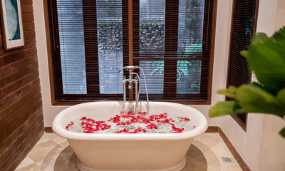 Villa Oost Indies Bathroom One Bathtub with Rose Petals | Seminyak, Bali