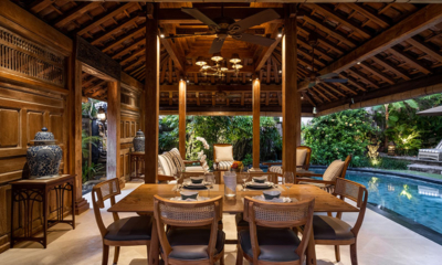 Villa Oost Indies Pool Side Dining Area at Night | Seminyak, Bali