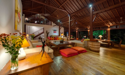 Villa Paloma Indoor Living Area with Wooden Floor at Night | Canggu, Bali