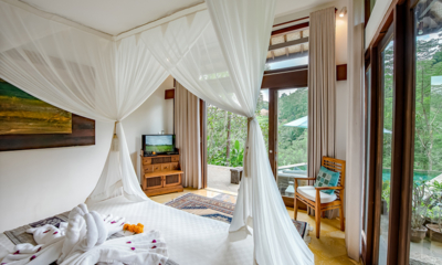 Villa Umah Shanti Sriwijaya Room Bedroom with Mosquito Net and Pool View | Ubud, Bali