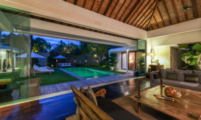 Villa Alabali Indoor Living Area at Night with Pool View | Seminyak, Bali