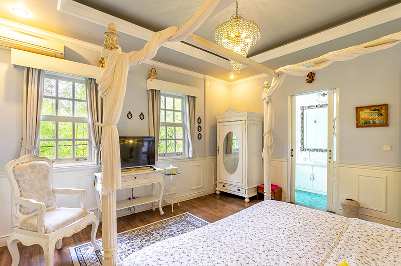 Niconico Mansion Bedroom Three with TV and Wooden Floor | Seminyak, Bali