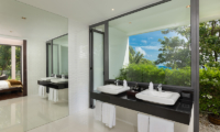 Baan Santisuk His and Hers Bathroom with Mirrors | Patong, Phuket