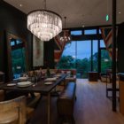 Millesime Living and Dining Area with Hanging Lamp and View | Hirafu, Niseko