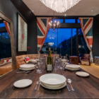 Millesime Living and Dining Area with View at Night | Hirafu, Niseko