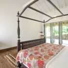 Ivory House Bedroom with Four Poster Bed and Wooden Floor | Galle, Sri Lanka