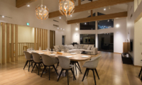 The Orchards Niseko Sawara Living and Dining Area Night View | St Moritz, Niseko