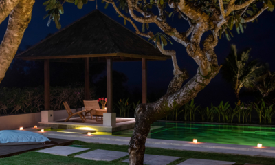 Surga Villa Estate Villa Surga Two Pool Side Seating Area at Night | Ungasan, Bali