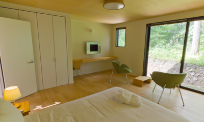 Gakuto Villas Master Bedroom with Seating Area and View | Hakuba, Nagano
