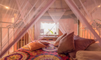 Round House Bedroom with pink Pillows | Seminyak, Bali