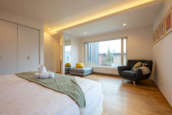 Yuzuki Bedroom Two with Seating Area and View | Hirafu, NIseko
