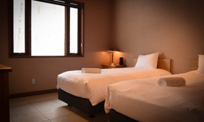 Powderhouse Bedroom with Twin Beds and Window | Hakuba, Nagano