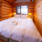 Villa Rusutsu Family Loft Villa Bedroom with Wooden Floor and Side Lamps | Rusutsu, Japan