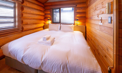 Villa Rusutsu Family Loft Villa Bedroom with Wooden Floor and Side Lamps | Rusutsu, Japan