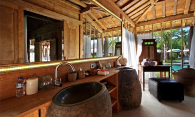 Blue Karma Villas Umalas Villa Kayu His and Hers Bathroom with Pool View | Umalas, Bali
