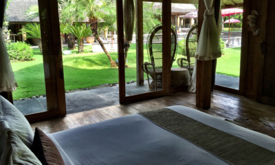 Blue Karma Villas Umalas Villa Kayu Bedroom with Wooden Floor and Garden View | Umalas, Bali