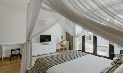 The Beach Villa Cemagi Bedroom One with Four Poster Bed and TV | Seseh, Bali