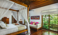 Villa Bukit Naga Bedroom with Couch and Garden View | Gianyar, Bali