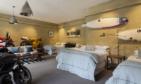 Ataahua Lodge Twin Bedroom with Motorcycle Model | Whakamarama, Bay of Plenty