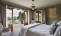 Ataahua Lodge Master Bedroom with Seating | Whakamarama, Bay of Plenty