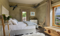 Ataahua Lodge Bedroom with Plane Model | Whakamarama, Bay of Plenty