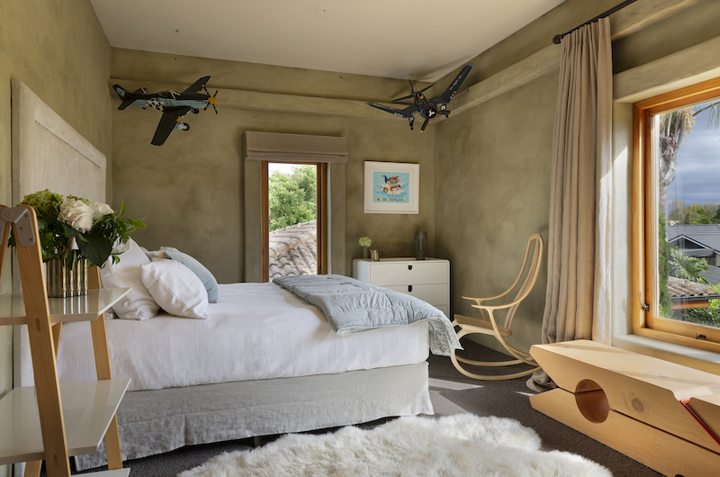 Ataahua Lodge Bedroom with Plane Model | Whakamarama, Bay of Plenty