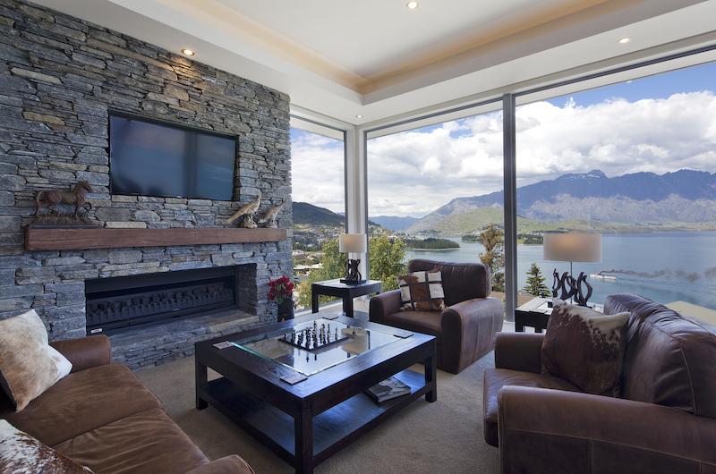 Aspen House Living Area with Fireplace Lake View | Queenstown, Otago