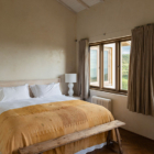 Muriwai Estate Bedroom with Side Lamps and View | Muriwai, Auckland