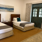 On The Rocks Seventh Bedroom with Twin Beds and Painting | Unawatuna, Sri Lanka