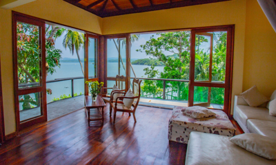 South Point Cottage Master Bedroom with Seating Area and View | Koggala, Sri Lanka