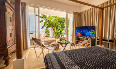 The Beach House Ocean Terrace Suite Bedroom with TV and Sea View | Mirissa, Sri Lanka