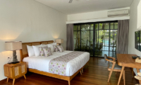 Villa Bogor Bedroom with TV and Wooden Floor | Canggu, Bali