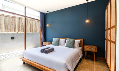 Villa Boddisatva Bedroom Five with Hanging Lamps and Side Tables | Pererenan, Bali