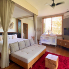 Villa Kimaya Bedroom with Baby Cot and TV | Canggu, Bali