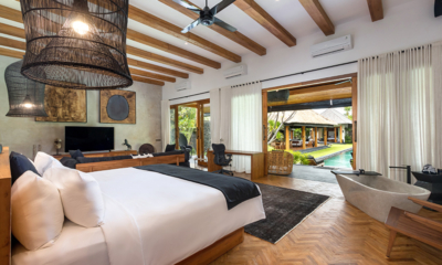 Villa Wolfe Bedroom One with TV and Pool View | Seminyak, Bali