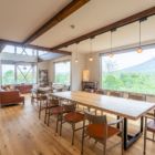 Sanga House Niseko Living and Dining Area with Hanging Lamps and View | East Hirafu, Niseko