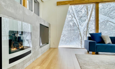 Sanzan Chalet Living Area with Fireplace and Snow View | Echoland, Hakuba