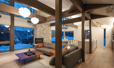 Silver Maple Chalet Living, Kitchen and Dining Area at Night | Echoland, Hakuba