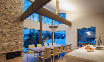 Silver Maple Chalet Kitchen and Dining Area with View at Night | Echoland, Hakuba