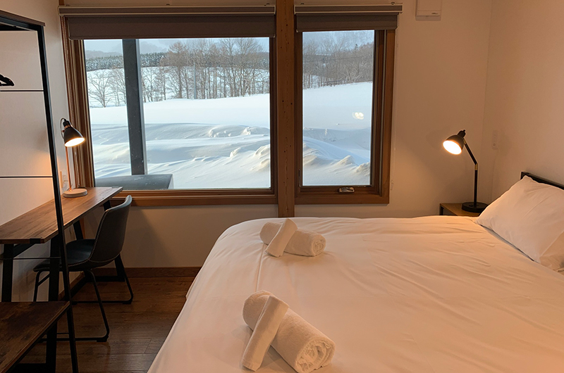 Hakobune Niseko Bedroom with Side Lamps and Snow View | Soga, Niseko