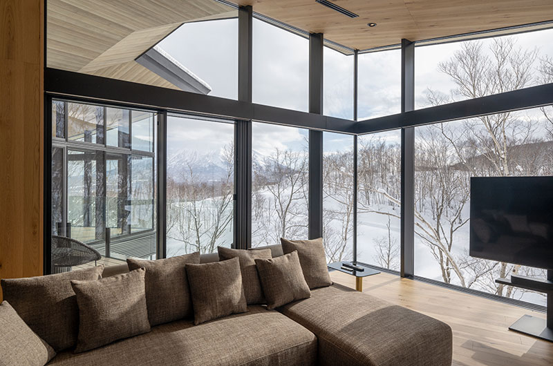 Tsubasa Chalet Living Area with TV and Snow View | Hokkaido, Japan
