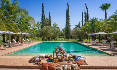 Palais Hassoun Pool Side Seating Area with Fruits and Juice | Marrakesh, Morocco