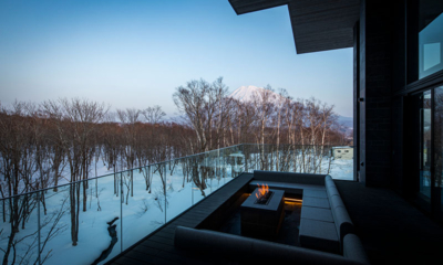 Corniche Hirafu Open Plan Lounge Area with Fireplace and Snow View | Hirafu, Niseko