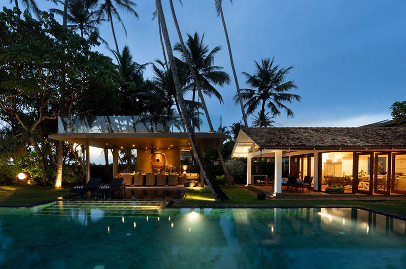 Victoria Villa Pool Side Living and Dining Area at Night | Talpe, Sri Lanka